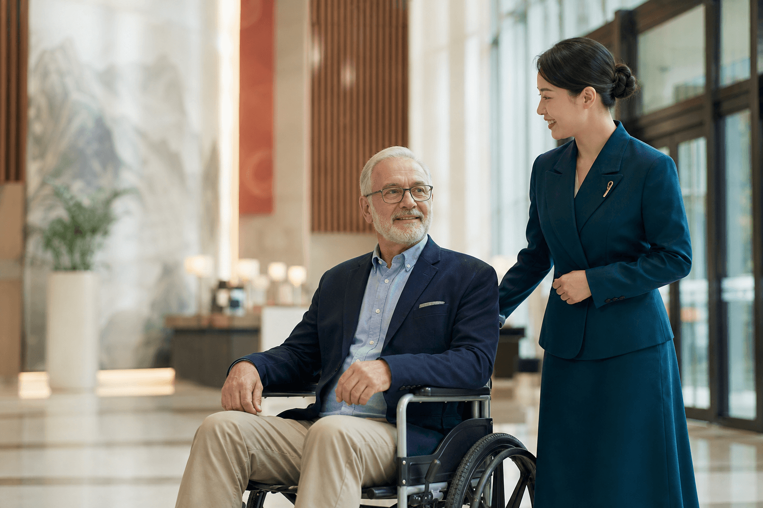 Senior international patient in a wheelchair with a medical concierge